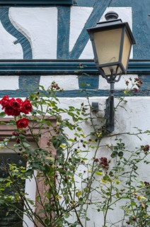 Street lamp on a historic half-timbered house, Eltville, Rheingau, Hesse, Germany