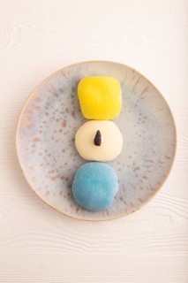 Japanese Mochi Cakes on white wooden background, top view, flat lay, copy space