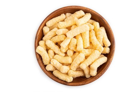 Corn flakes sticks with caramel in wooden bowl isolated on white background. top view, flat lay,