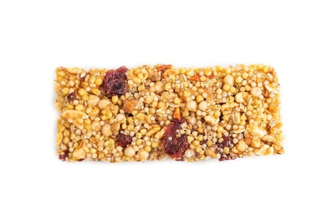 Granola bar with, caramel, nuts, flakes isolated on white background. Top view, flat lay, close up