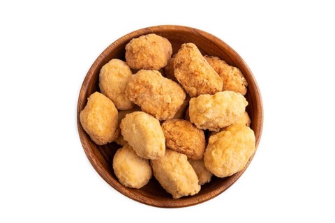 Fried crispy Chicken Nuggets in brown wooden bowl isolated on white background. top view, flat lay,