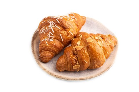 Croissant on blue plate isolated on white background, side view, close up