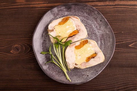 Chicken, egg and dried apricot meatloaf, microgreen on brown wooden. Diet, healthy eating. top