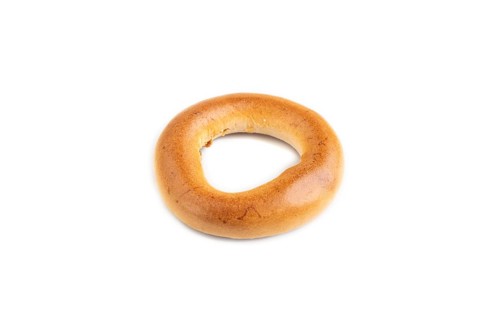 Homemade Ring Bagel isolated on white background. side view, close up