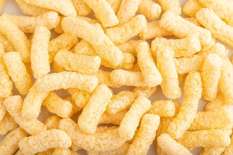 Corn flakes sticks with caramel isolated on white background. top view, flat lay, close up