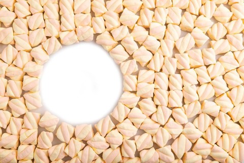 Round copy space on Orange and pink marshmallow background, top view, flat lay, minimalism