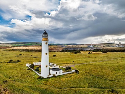 Rain Clouds over Barns Ness Lighthouse from a drone, Dunbar, East Lothian, Scotland, UK
