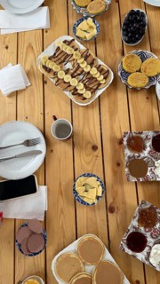Moroccan breakfast spread with a variety of sweet and savory dishes. Including msemmen. Baghrir