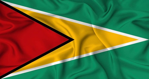 Realistic Guyana flag waving. Close up of flag of Guyana with cloth texture