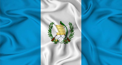 Realistic Guatemala flag waving. Close up of flag of Guatemala with cloth texture