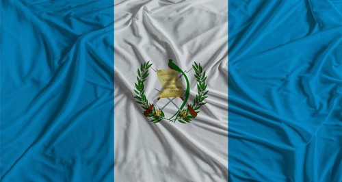 Guatemalan flag with fabric texture background. National flag of Guatemala
