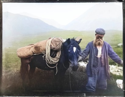 Colourised image of old man with pack horse carrying mountaineering equipment, thought to be