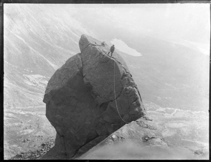 Climber with rope climbing The Cioch, The Cuillins, Isle of Skye, Scotland, UK c 1910-1920