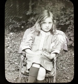 Magic lantern slide c 1900-1910 halftone portrait of pretty young girl sitting in a chair