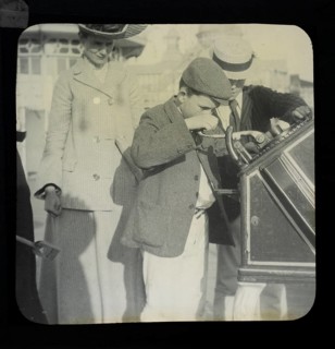 Magic lantern slide mother watching of two boys using a Roovers Metal Stamping Machine at the