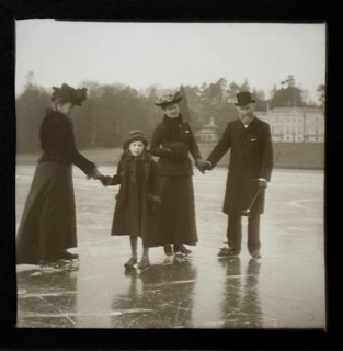 Magic lantern slide well-dressed middle class Edwardian family ice skating England, UK c 1900-1910