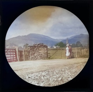 Woman Victorian or Edwardian tourist with background of Ambleside, Lake District, Cumbria, England,