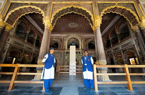 Indian woman guarding the Daria Daulat Bagh or Tipu Sultan's summer palace, Srirangapatna,