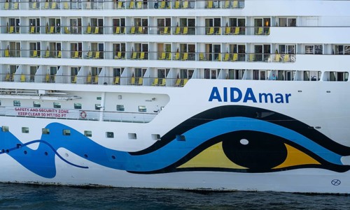 Close-up, cruise ship AIDAmar with striking blue and yellow livery, Warnemünde, Rostock,