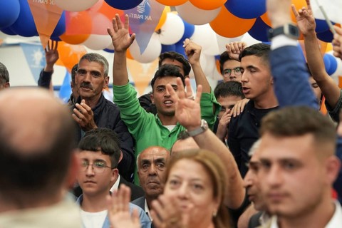 Gaziantep, Türkiye – May 28, 2023. Turkish citizens wave flags of Türkiye and the ruling Justice