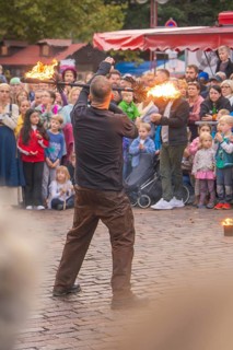 A juggler presents fiery arts in front of an astonished audience, Feuernacht, Sindelfingen, Germany