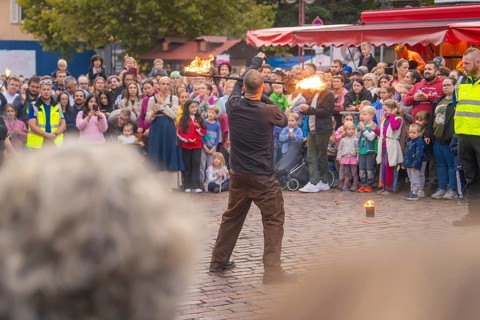 A fire juggler fascinates the audience with his art in a lively setting, Feuernacht, Sindelfingen,