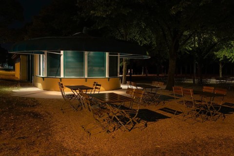 Night shot of a closed kiosk with seating in the Herrenhausen Gardens, Herrenhausen, Hanover, Lower