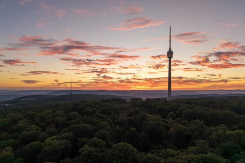 TV tower at dawn with dramatic clouds over forested area, Stuttgart-Degerloch, Baden-Württemberg,