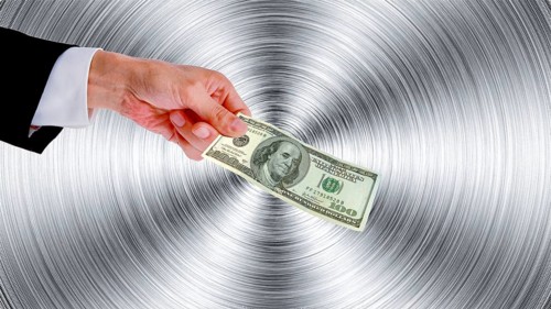 Symbolic image, hand reaches out 100-dollar note, purchasing power, stable currency, currency war,