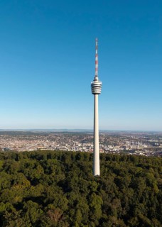 View of a television tower above a forest with a cityscape behind it, Stuttgart, Baden-Württemberg,