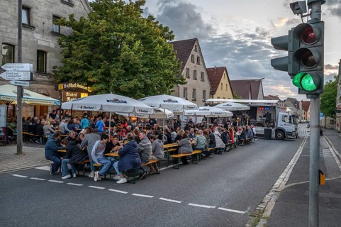 Residents celebrating Kirchweih in front of an inn on the closed B2, Eschenau, Middle Franconia,
