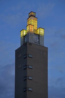Albinmüller Tower built in 1927 by architect Albin Müller, spire with illumination during twilight,
