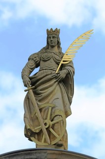 Patron saint Catherine of Alexandria with palm branch at St Catherine's portal built in 1668,