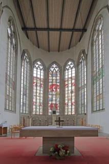 Chancel with colourful stained glass windows and altar, interior view, St. Petri Church, Magdeburg,