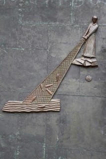 Relief with fisherman with fishing net in water at the church door, biblical parable, biblical