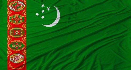 Turkmen flag waving. Flag of Turkmenistan with cloth texture
