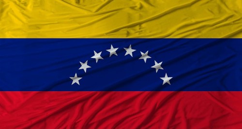 Venezuelan flag waving. Flag of Venezuela with cloth texture