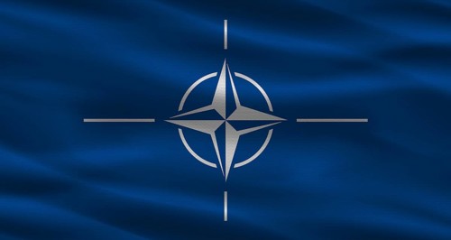 NATO flag with fabric texture. Realistic flag of NATO waving