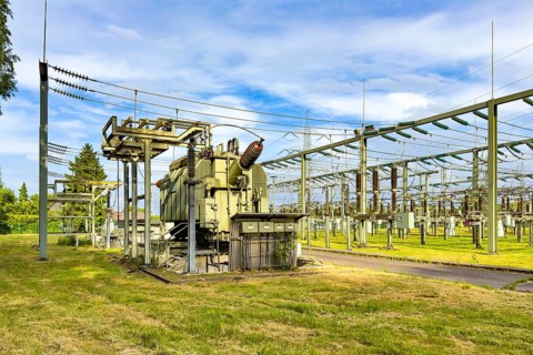 Left large transformer transformer transformer power transformer in substation, right hanging