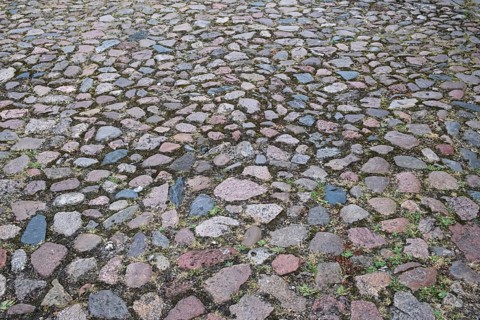 Cobblestone street of irregularly arranged grey stones, North Rhine-Westphalia, Germany