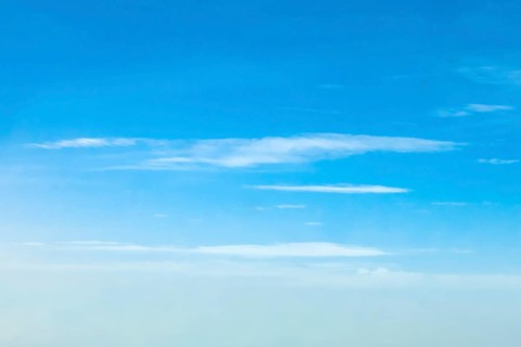 Altostratus clouds at an altitude of around six 6 kilometres under a blue sky, international