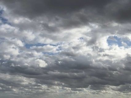 Heavily overcast sky with dark nimbostratus clouds rain clouds at the top and bottom of the
