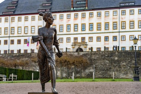 Bronze sculpture of Duchess Luise Dorothea of Saxe-Gotha-Altenburg in front of Friedenstein Castle