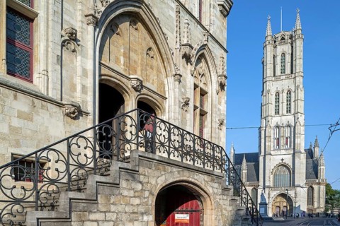 13th century Gothic St Bavo's Cathedral and entrance to the 14th century medieval belfry in the