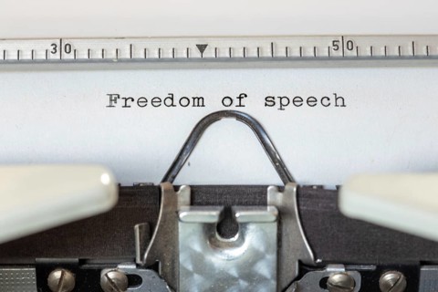 FREEDOM OF SPEECH, written with a typewriter