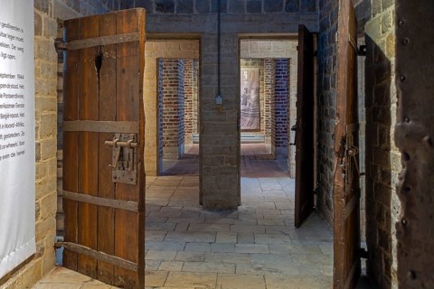 Old wooden cell doors in Het Toreke museum, former 19th century prison at the Grote Markt in the