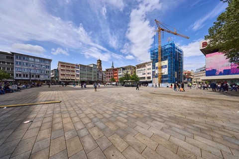 Square, general architecture, pavement slabs, construction site, scaffolding, crane, pedestrians as