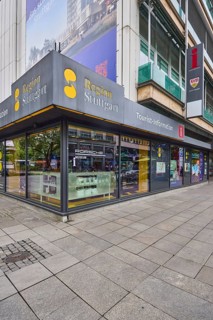Tourist information centre, building, shop window, pavement made of paving slabs, pedestrian zone,