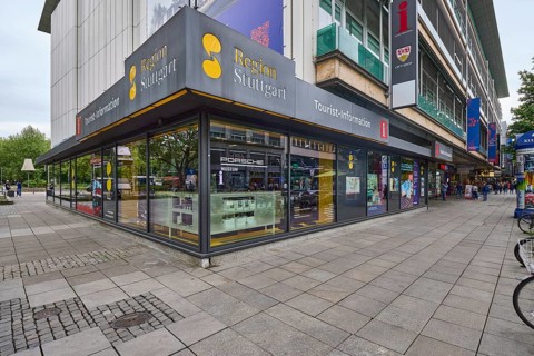 Tourist information centre, building, shop window, pavement made of paving slabs, pedestrian zone,