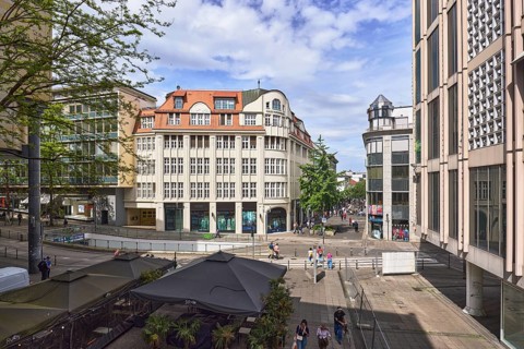City centre, general architecture, shops, pedestrians as accessories, elevated perspective, blue